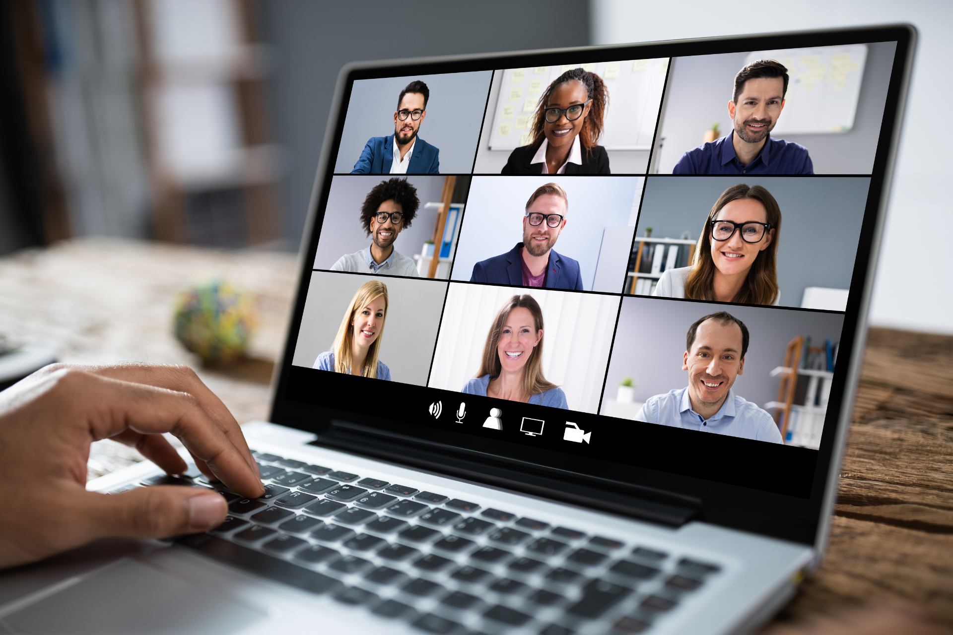 A virtual coaching session in progress on a laptop screen with nine participants.