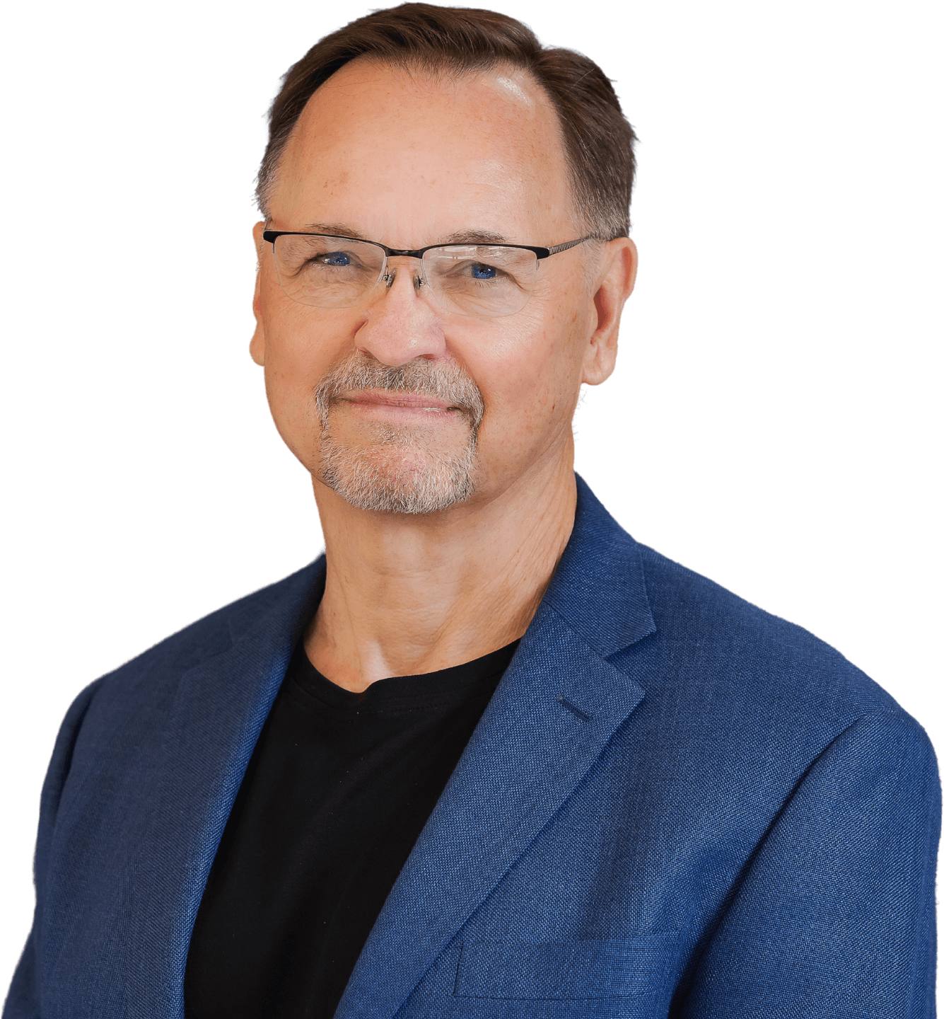 Middle-aged man with glasses and a slight smile, wearing a blue blazer, isolated on a black background.