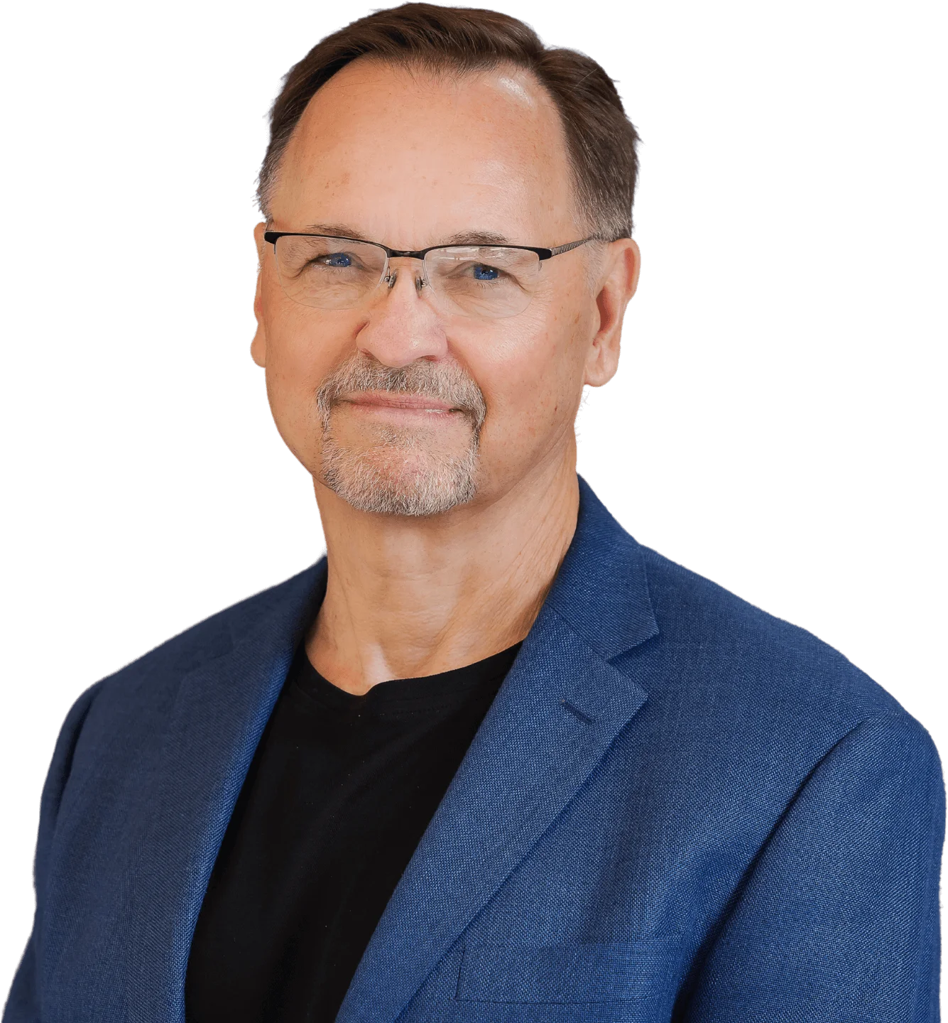 Middle-aged man with glasses and a slight smile, wearing a blue blazer, isolated on a black background.