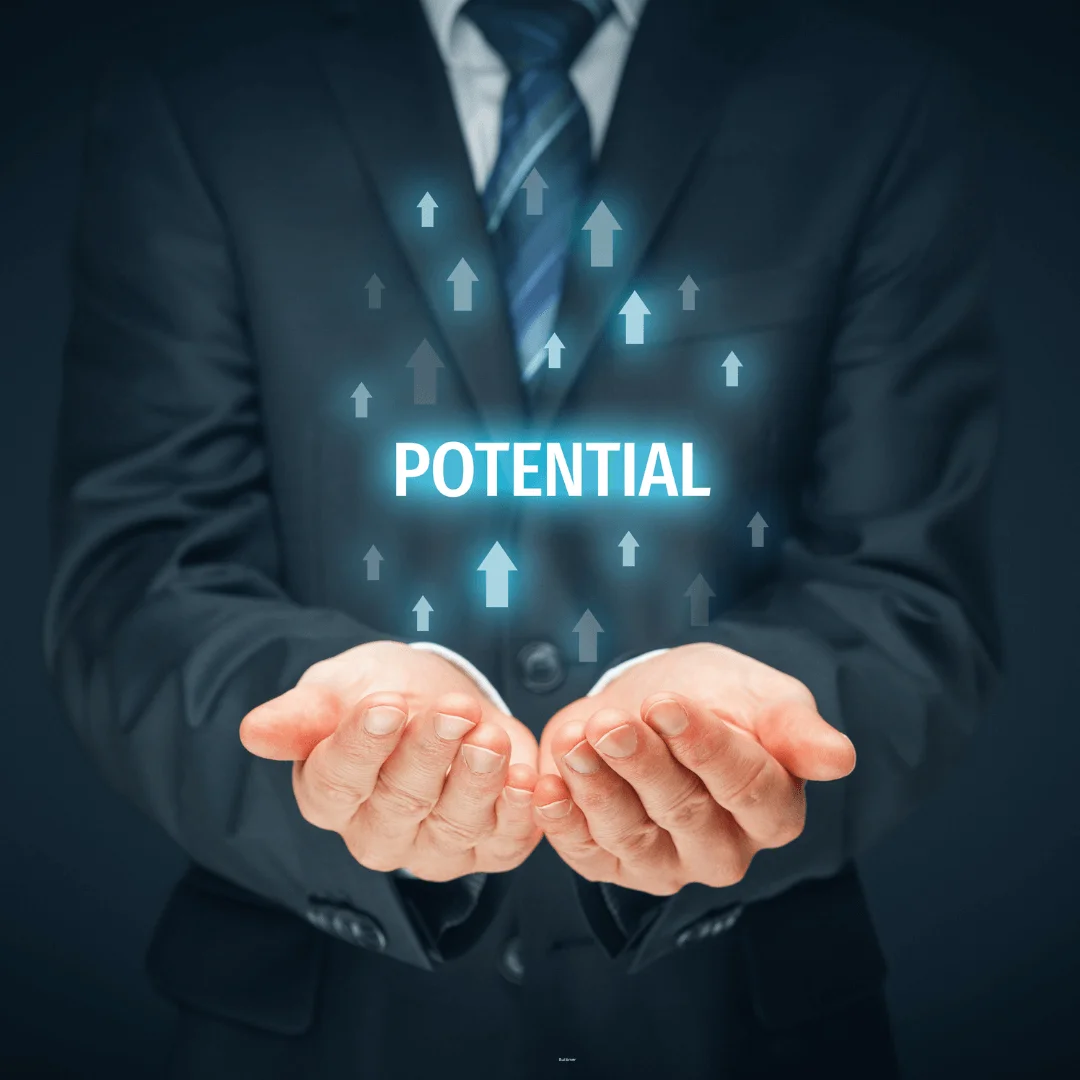 A person in a suit holds their hands open beneath the word "POTENTIAL," with upward-pointing arrows, embodying the essence of entrepreneurial coaching.