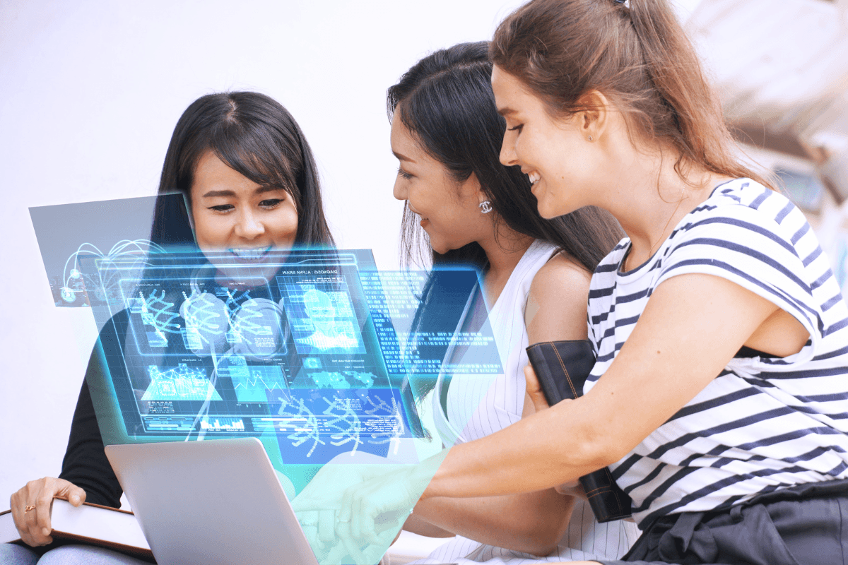 Three women look at a laptop displaying holographic scientific data, including DNA structures and analysis charts, exploring how AI for Leadership can address leadership challenges in scientific research.