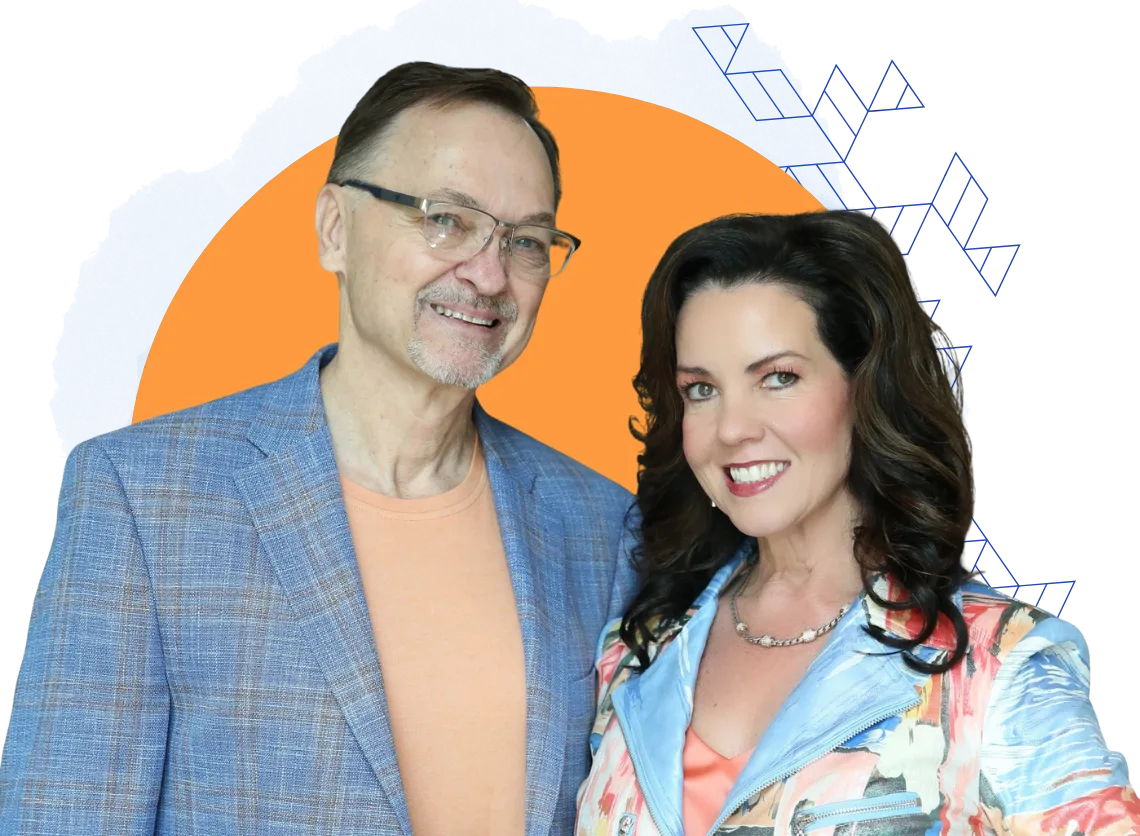 A man and a woman stand together smiling, dressed in patterned blazers, in front of an abstract orange and blue background, reflecting a confident consulting vibe.